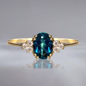 Golden Oval Cut Blue & White Sapphire Engagement Ring